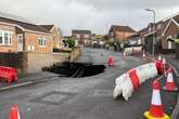 Residents can go home after huge 60ft sinkhole opened up on street