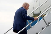 Trump stumbles on steps up to Air Force One