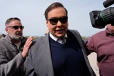 Disgraced former GOP Rep. George Santos reports to prison