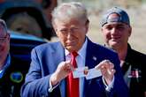 Trump boasts with fry cook pin while surveying hurricane damage