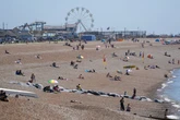 Man dies on packed beach on hottest day of the year