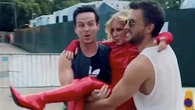 Kylie Minogue carried to BST stage by Andrew Scott and Jonathan Bailey