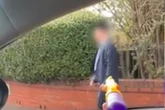 Men in car spray water pistol at Orthodox Jews