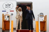 Macron and wife Brigitte smiles and hold hands after shove video