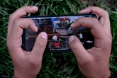 Teenager given 100 years in prison for killing family over online game