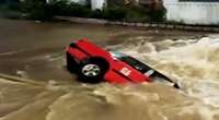 Hong Kong taxi driver and passenger escape as car falls into sinkhole