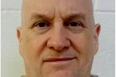 Manhunt for police chief who escaped prison in law enforcement outfit
