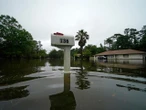Neighbourhoods swamped by tropical storm Claudette on Gulf Coast