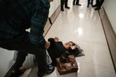 ICE agent suspended after shoving woman and saying ‘adios’
