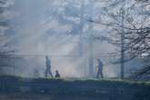 Texas wildfire prompts evacuations as Arkansas and Florida also battle blazes