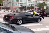 Shocking video shows cop on the hood of a moving car before shooting