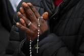 As Pope languishes in hospital, thousands gather to pray the rosary