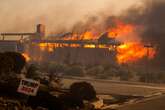 California homes engulfed by flames as blaze forces thousands to flee