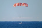 First manned Moon mission in more than 50 years splashes down after epic voyage