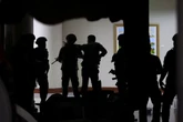 Gunshots fired in senate as senator faces international arrest