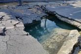 Large sinkhole opens up in middle of road near Clapham Common