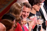 Winking Macron clinks glasses with royals at dazzling state banquet
