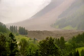 Glacier collapse buries parts of Swiss village under mud and rock