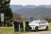 Two people arrested in Porepunkah shooting as manhunt continues
