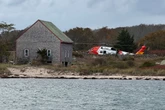 Woman dies after boat fire left her stranded on island with family