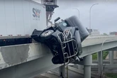 Terrifying moment trucker calls 911 as his cab hangs off bridge