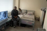 Mother and daughter sleep in living room after family put in tiny flat