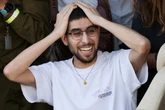 Israeli hostage forced to dig his own grave reunited with his family