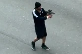 Two critical after gunman fires up to 60 rounds into traffic