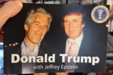 Pranksters fill Trump Tower store with photos of Epstein and president