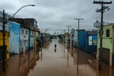 Live: Brazilians navigate floods by boat as at least 90 people dead
