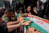 Iran's government says at least 1,060 people were killed in the war with Israel