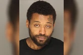Man who pulled gun in church is charged after his cousin’s body found