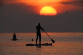 Russia detains tourist who entered country on paddle board