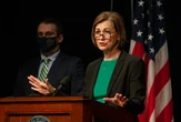 Iowa governor questions migrant flights into Des Moines