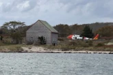 Family rescued from Massachusetts island after their boat caught fire