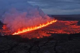Tourists evacuated as Iceland volcano erupts opening up 1km-fissure