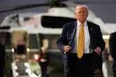 The Latest: Air strikes, ICE crackdown and shutdown continue with Trump in Asia