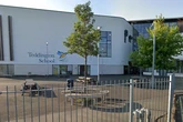 Emergency services swarm secondary school as man dies