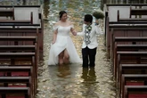 Couple weds in flooded church after Typhoon Wipha hits Philippines