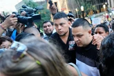 Photos of Abrego Garcia turning himself in at ICE office surrounded by family and supporters