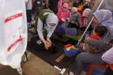 Indonesia’s free school meals program under fire as children fall ill