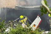 Two killed after small plane crashes into house