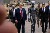 Trump posts AI photo of himself with buff alien in latest social spree
