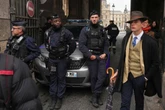 The true story behind that viral Louvre jewel heist mystery man photo