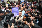 Tommy Robinson denies harassing two Daily Mail journalists