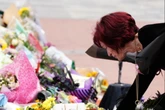 Sharon Osbourne lays flowers at Ozzy memorial at Birmingham parade