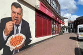 Mystery artwork of former England boss eating chips appears