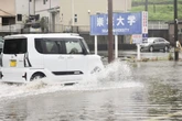 Japan moves to evacuate millions as torrential rain triggers flooding