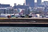 Qantas emergency landing sparks grassfire after engine failure