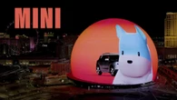 Mini Takes Over The Sphere In Las Vegas, Showing Its Dog Mascot And The New Countryman EV